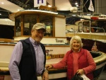Patti and Barry (C-Cakes) standing in 
front of restored Ranger Tug SBS