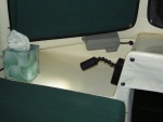 LED swivel reading light mounted on port dash.  Can be used over the shoulder of person sitting at the table or sitting sideways with back against port side.