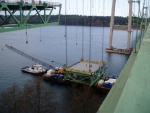 We were lucky to be on the bridge when a lift was to take place. Here the barge has been moved into position under the gantry crane and the lifting cables are attached