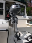Honda 2 HP outboard in place.  I will attach a 6x6 piece of starboard to the base of the splashwell below the OB skeg with screws to prevent damage. 