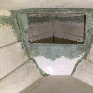 The green TotalBoat fairing compund looks ugly now, but it wil be fine when all is painted. This modification was made so that a Tempress 1323 cam latch hatch can be installed to close off the anchor locker.