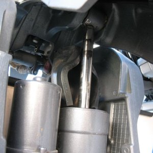 M-Y Wedge slipped out of place and deformed, not sure why (did work fine for a different 3,000-mile tow).  This allowed the motor to come down somewhat, but luckily not all the way as it "wedged" between the tilt cylinder and the transom.