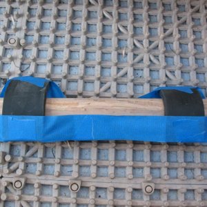 Made a new wedge out of materials I had with me on the road (1" x 2" scrap, planed top edge at 45? to contact motor better than the original, "sharp" edge).