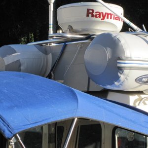 Dinghy is actually hung from the radar arch using a ratchet strap that hooks onto the transom. Front is tied down to roof rails.