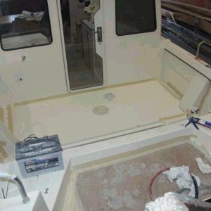Fuel tank lid, screwed to cleats and sealed.  The lid can be removed easily without cutting the deck.