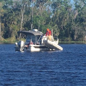 Dinghy clearing water.