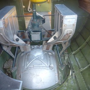 belly gunner inside a b-17 50 caliber magazines are the silver boxes. On display at the Marathon airport for a few days
