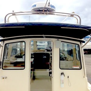 Anglers Awning made with Top Gun Material provides protection from rain, wind and sun. Its cantilever design does not get in the way when boarding or fishing.