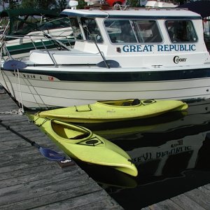 Great Republic and kayaks at Burton Island dock. Kayaks travel in cockpit.