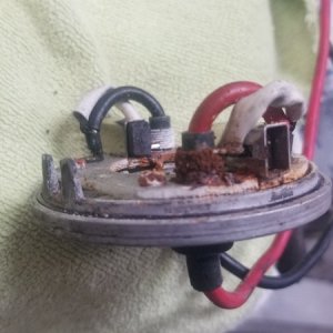 The end bell of a Lewmar V700 windlass showing corrosion of the motor brush springs
