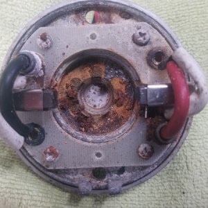 The end bell of a Lewmar V700 windlass motor, showing corrosion of the armature bushing clip