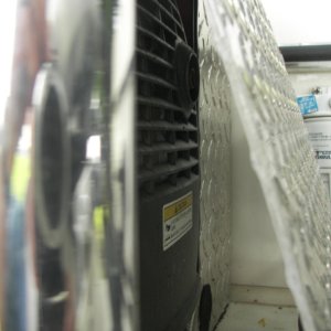 This allows variable opening. A larger hole had to be cut to get the 30 amp plug frame into the box. A simple i2000 would not need such a large cutout. West Marine sells a nice 7 inch SS cowl vent that would work if installed after the box is slid in place. I had no problem with salt water intrusion, had drain holes and a series of screened vents up against the transom down low for fuel vapor run-off.