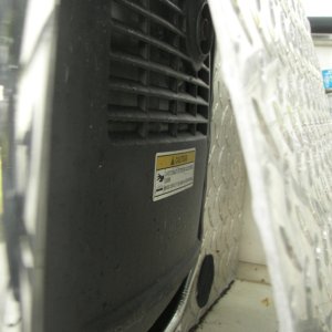 This is the most extreme cut-out you'd need and I still had very little seawater intrusion.  I had to allow for the genset to slide this way for the 30 amp yoke to clear the restricted lid opening.