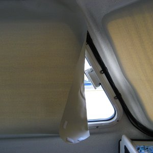 Media 'Leading edge of large side windows needs folding back when rolled up.  This leaves a crease but we aren't that picky' in album 'hook side pieces on frame'