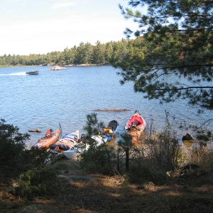 Media 'Pulling in to camp after a long paddle.' in album 'Typical island, some like this may have a cottage. Unfortunately, this one had a fire.'