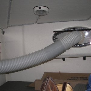 Media 'Using screen as template, cut and fit outlet fitting to clip into screen flanges of TomCat windows. 'Had to offset hole upward to leave room for bottom clip. Plastic strips (3) came with A/C.' in album 'Final 12k Btu, removable A/C. SPT brand from Pep Boys @$479. 9k Btu was $379. No drain needed. Clears 65 pts. water/day w/o drain line. Air output can be directed straight up.'