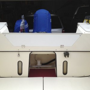 Outboard well Bulkhead  viewed from cockpit 
Bulkheads were made using 1/2" Starboard, 
Stainless Steel Hinges, anodized 
aluminum top edge cap and 1"x1" x1/8" 
aluminum brackets at upper top corners