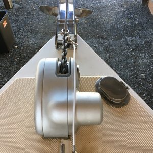 Pivoting bow roller and anchor safety strap