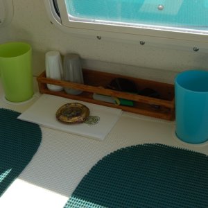 Stress reducing shallow cup holders