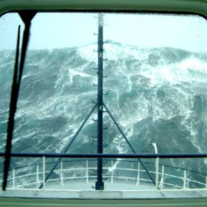 Typical cruising seas for a C-Dory, the Tomcat is just on the other side of the crest leading the way