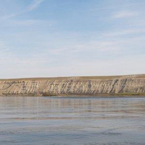 It's hard to get a feel for the size of the cliffs from a picture.  The trees at the base are 20 to 30 foot cottonwoods.