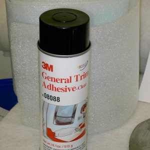 (Lynn Marie) Adhesive used for the project. Can is sitting in front of the 8" wide closed cell sill sealer used under the carpet on the hull sides.