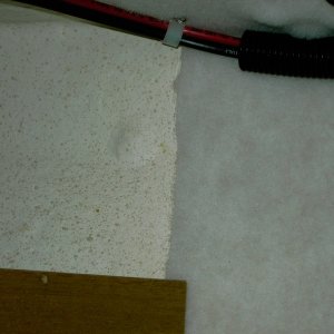 (Lynn Marie) Close-up of hull gelcoat & hulliner carpet. Both have similar white and tan colors.