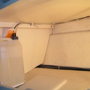 (Dora~Jean) Fuel reservoir, note no drooping lines between heater and reservoir, important. Bungee strap was added later.