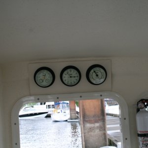 My "weather station" mounted above the cabin door - Weems & Plath Barometer, Clock and Tide Clock (Nightwatch in black finish)