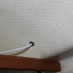 Antenna cable comes out inside the cabin roof.