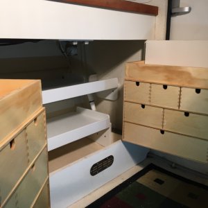 Media '015 I added a cubby on top of those IKEA drawers' in album '01 there was a plastic drawer thing in the middle on those rails'