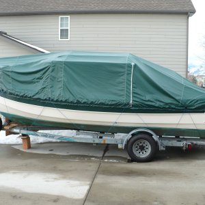 Angola Cover with side zipper. Be sure you order it where the motor is covered too. We get about 150" of snow and it all gets dumped into the motor well unless you have the motor cover. Also, they need to add about 6 inches to the sides so it covers more of the boat/stripe.