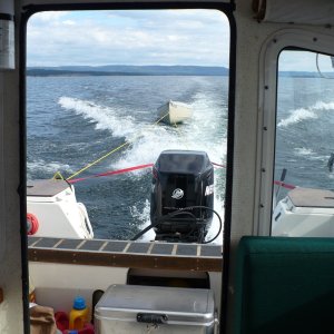 Fare West II towing the big canoe