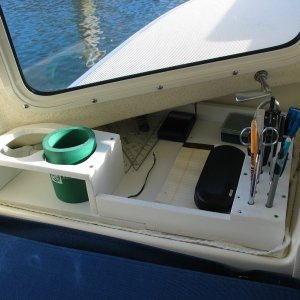 (Not For Hire) Portside dashboard organizer made of starboard. Knew my junk would all fall through to the v berth without this.