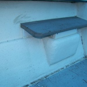 The tread is plastic decking board, the framing is pvc bricktrim. It is ss screwed together and to the original step along with liberal 4200.