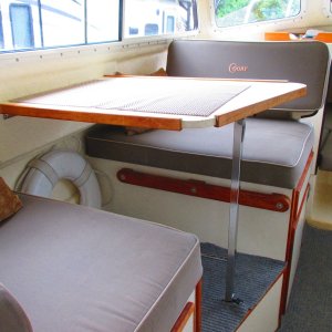 Table drops down to make another berth.