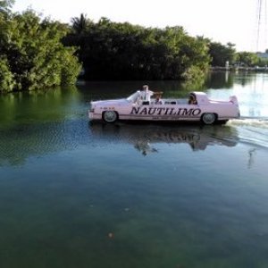 Cadillac convertible made into a boat. A newly married couple enjoying a sunset cruise. You gotta love the Florida Keys