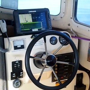 Hard working helm. Square meter is an amp meter. Fell motor kill switch control is the round shape below the deck lights: bottom left.