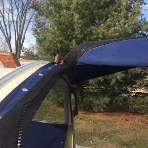 Modify Bimini with two zippers.  Easier to get in/out with bimini installed.