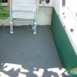 Flooring .3/4 Ply with resin and rug covering with Starboard feet