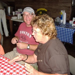 Judy talking with her hands...Jim isn't paying attention.