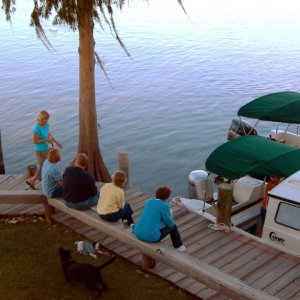 Setting on the Dock of the River