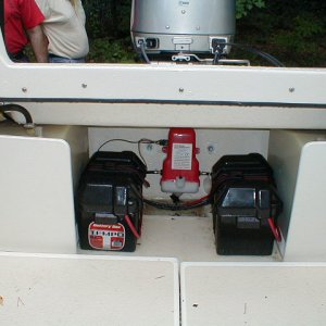 Batteries mounted next to gas tanks, freeing up lazarettes.