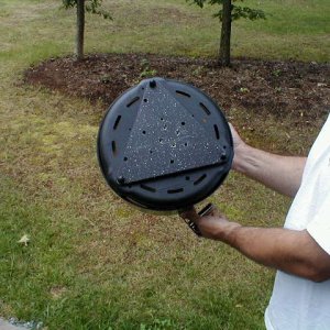 I used a black cutting board purchased at Target to custom make a mount for the Cobb Barbeque