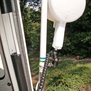 A Ram ball mount to hold my Optronics 1 million candlepower 12v spotlight.  It is mounted with a stainless U bolt and RAM mount to the antenna.  I can reach out the starboard side window and direct the beam.