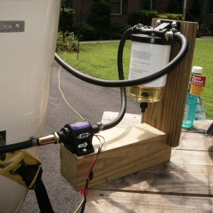 fuel polisher built on the Dr. Bob design.  I used scraps of pressure treated lumber, a 12v fuel pump, an a fuel separator with clear bottom.  Wired with 6 feet of quick conncect wire, inline on/off switch, and battery clips.
