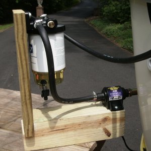 12v fuel pump siphons the gas from the tank and pushes it through the 10 micron filter.  Fuel pump is equipped with a 100 micron pre-filter.