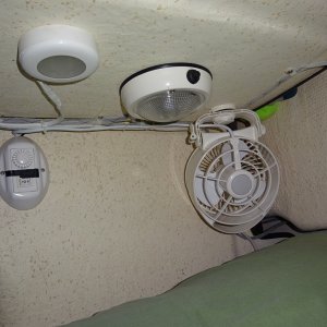 Fans in my corner, light in the middle, red or white, and remote control.  All LED lighting on the boat.  Black tape to subdue the "blue night light" on the remote.