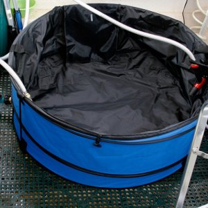 Hot Tub before filling - Return hose from the heat exchanger is terminated by a hose nozzle or a shower head. The hose nozzle is left open while water is recirculating.