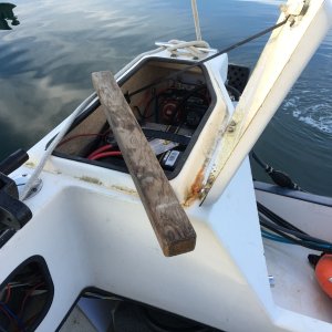 This piece of wood was wedged in the lazarette to hold the battery in place.